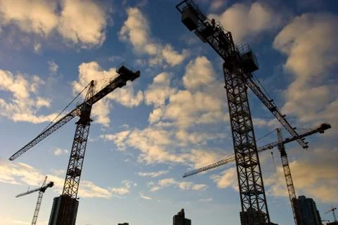 Wide angle view of a construction site with many cranes Stock Photos