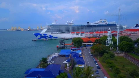 Wide angle View of Cruise ship with beautiful city on sight Stock Footage 120357993