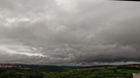 Wide angle view of dense, dark gray storm clouds filling the overcast sky Stock Footage 345011242