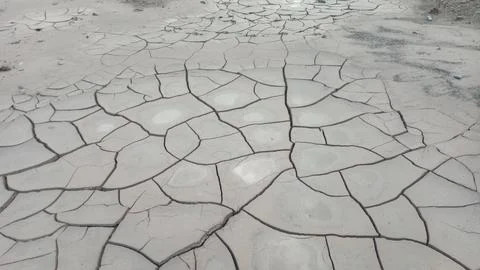 Wide Angle View of Dry Cracked Clay Mud and Arid Drought Soil Pattern Stock Photos