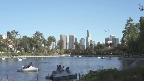 Wide angle view of Echo Park Lake with downtown Los Angeles skyline Stock Footage 75882001