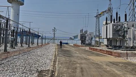 Wide angle view of electrical engineer worker with red helmet inspecting. Stock Photos