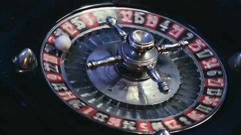 Wide Angle View of an Elegant Casino Roulette Wheel Spinning with Ball Stock Footage 335891536