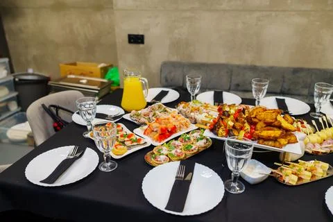 Wide angle view of an elegant party event buffet table with diverse food Stock Photos