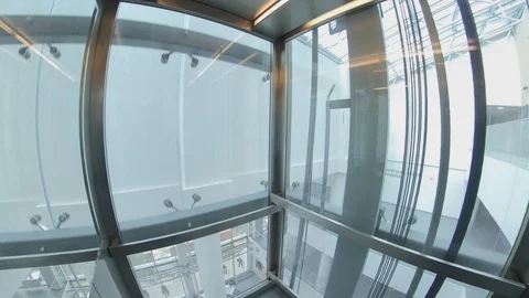 Wide Angle View of Elevator Interior with Glass Walls POV Vídeos de archivo 125456050