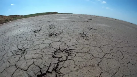 Wide angle view of Flying over cracked Earth of salt lake Elton. Stock Footage 142628392