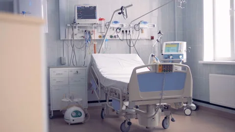 Wide angle view of a fully-equipped hospital ward with a single bed Stock Footage 87463552