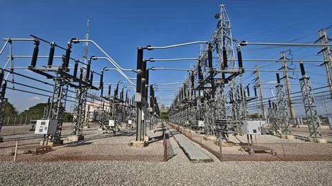 Wide angle view of high voltage electrical power substation switchyard. Stock Photos
