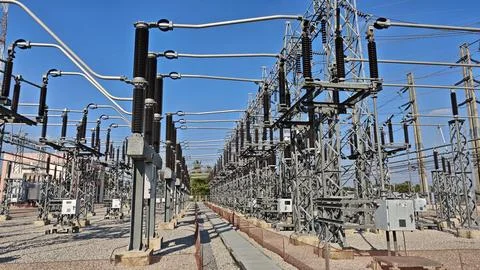 Wide angle view of high voltage electrical power substation switchyard . Stock Photos