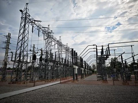 Wide angle view of high voltage electrical power substation switchyard . Stock Photos