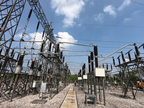 Wide angle view of high voltage electricity substation switchyard. Stock Photos
