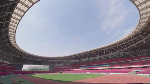 Wide Angle View Inside Empty Modern Stadium with Green Field Stock-Footage 335471266