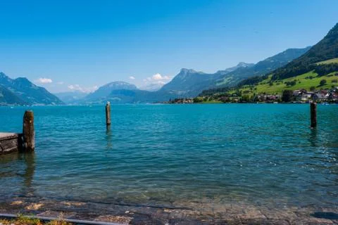 Wide angle view of lake Lucerne as seen from th shore in Bouchs city on a sun 스톡 사진