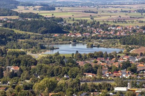 Wide angle view at landscape with small lake and houses from Veste Coburg Stock Photos