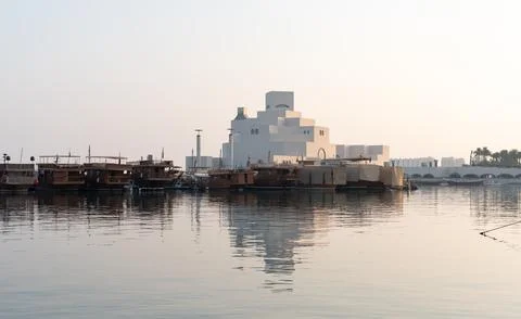 Wide angle view of Museum of Islamic Art and dhow fleet at down, Doha Stock Photos