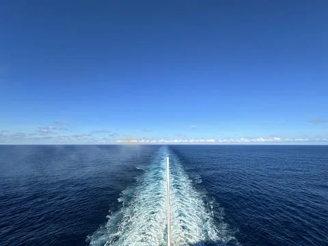 Wide angle view of the ocean behind a cruise ship with copy space for text in th Stock Photos