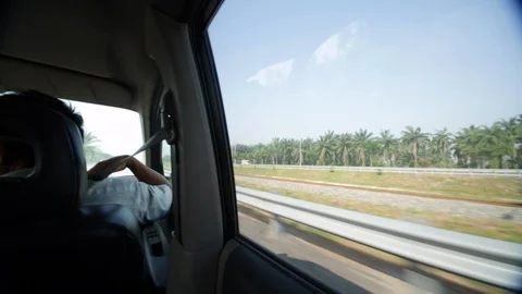 Wide angle view from passenger seat of a car in Indonesia Stock Footage 107656069