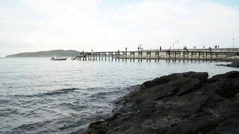 Wide angle view of people walking on a pier Stock Footage 75918769