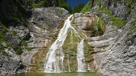 Wide angle view of a picturesque waterfall in summer 스톡 동영상 260833976
