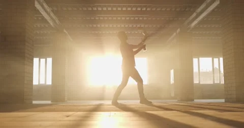 Wide angle view of Professional bartender juggles bottles. The bartender is 스톡 동영상 154353298