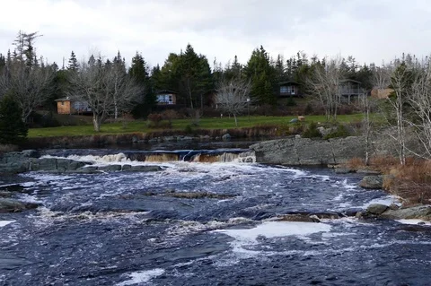 Wide Angle View of a River with Small Waterfall Stock Footage 70053938