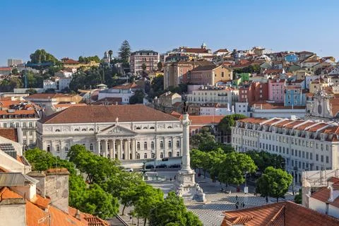 A wide-angle view of Rossio Square. shows the grand National Theatre and a ce Stock Photos