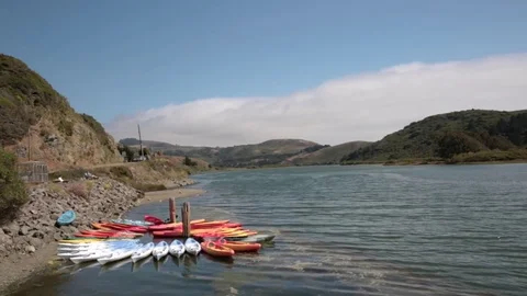 Wide angle view of Russian River with kayaks in Jenner, California Stock Footage 79549853