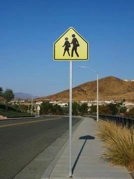 Wide angle view of school crossing sign Stock Photos