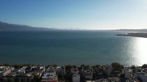 Wide angle view of a seaside city with bridge across island horizon Stock Footage 343945215