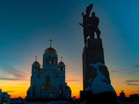Wide angle view of soviet monument and church in Yekaterinburg at sunset Stock Photos