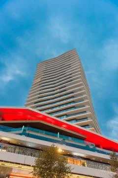 Wide angle view to steel light blue background building Stock Photos