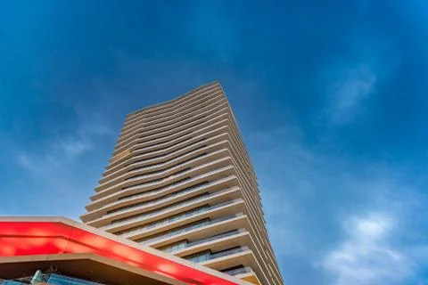 Wide angle view to steel light blue background building Stock Photos