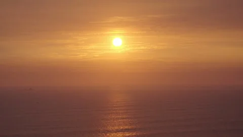 Wide Angle View of Sun Setting Over Calm Sea Video stock 311332176