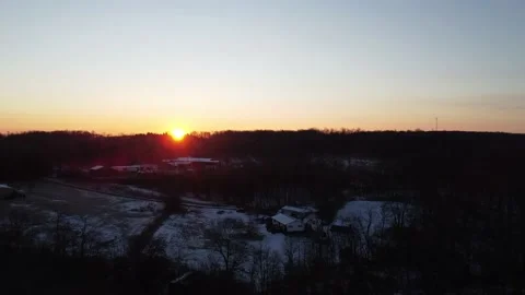 A Wide-Angle View of a Sunrise in the Winter and Windmills in the Distance 스톡 동영상 158133687