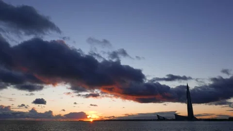 Wide-angle view of sunset at Neva Bay, Lakhta Center skyscraper, dark clouds Stock Footage 279219046