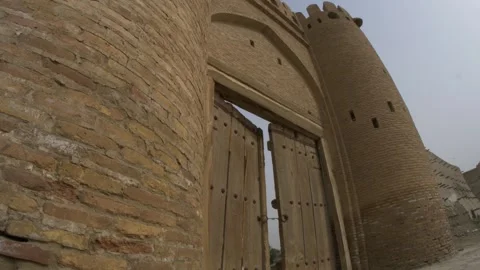 Wide-angle view of the Talipach gate at the ancient fortress wall in Bukhara Stock Footage 250750223