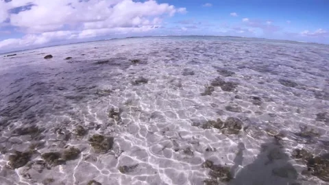 Wide angle view of waking in a crystal clear turquoise blue shallow lagoon salt  Stock Footage 250401897