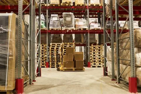 Wide angle view at warehouse interior with stack of boxes Stock Photos