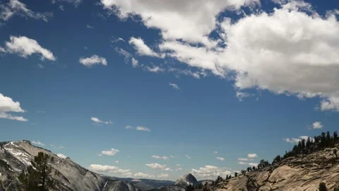 Wide Angle View of Yosemite Valley, Half Dome, with Blue Sky and White Clouds Stock Footage 226293582