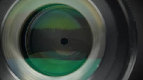A wide-aperture portrait lens featuring aperture and diaphragm blades Stock Footage 333075506