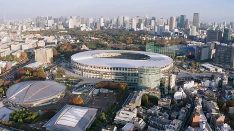 A wide-arc rotating 4kdrone shot of the the Japan National Stadium and the 스톡 동영상 141139613