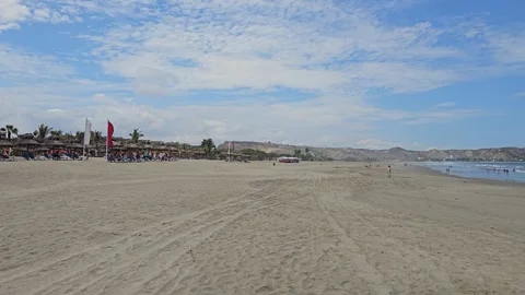 Wide Beach Flat With Tracks and Distant Beach Bars, Punta Sal, Peru 8K Stock Footage 331482885