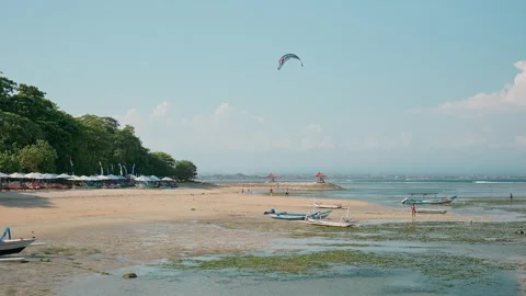 Wide beach view with kite surfer , Karang Beach, Bali Vidéo 336514742