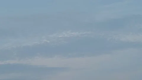 Wide blue sky background with soft white wispy cumulus clouds Stock Footage 337754501