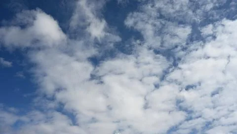 Wide Blue Sky with Dynamic Clouds for Sports, Travel and Outdoor Leisure Themes Stock Photos