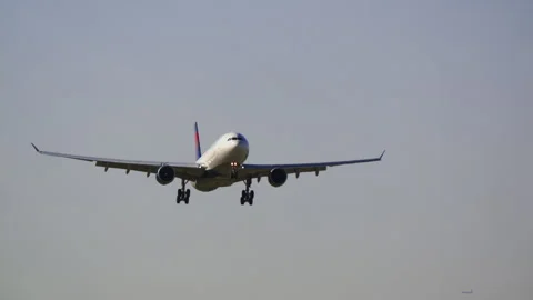 Wide body jet on final approach front view Stock Footage 337784750