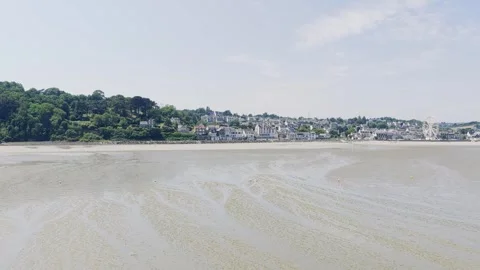 A wide, bright summer view of the sandy beach and coastal town of Binic Stock Footage 346689849