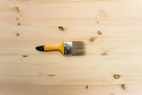 Wide brush over a pine table. Stock Photos