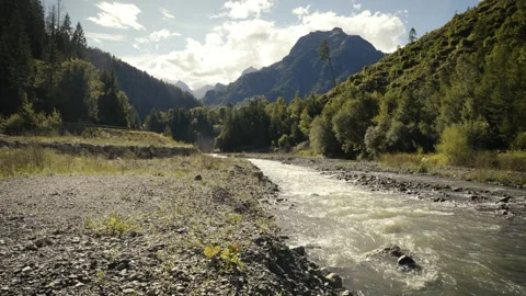 Wide Camera View of Mountain Stream and Distant Waterfall, Dolomites Stock Footage 316821062