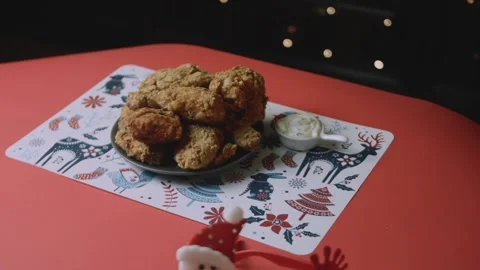 Wide christmas table setting with fried chicken centerpiece Stock Footage 342129147